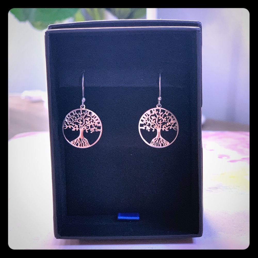 Sterling silver tree of life dangle earrings.